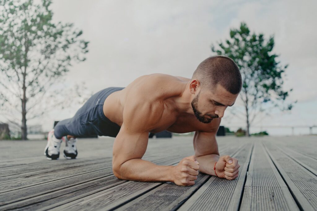 Man holding a plank, the core endurance event of the AFT